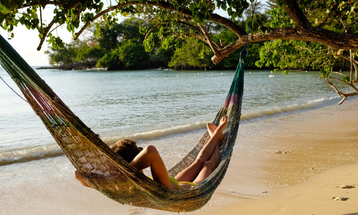 Woman on a deckchair by the shore
