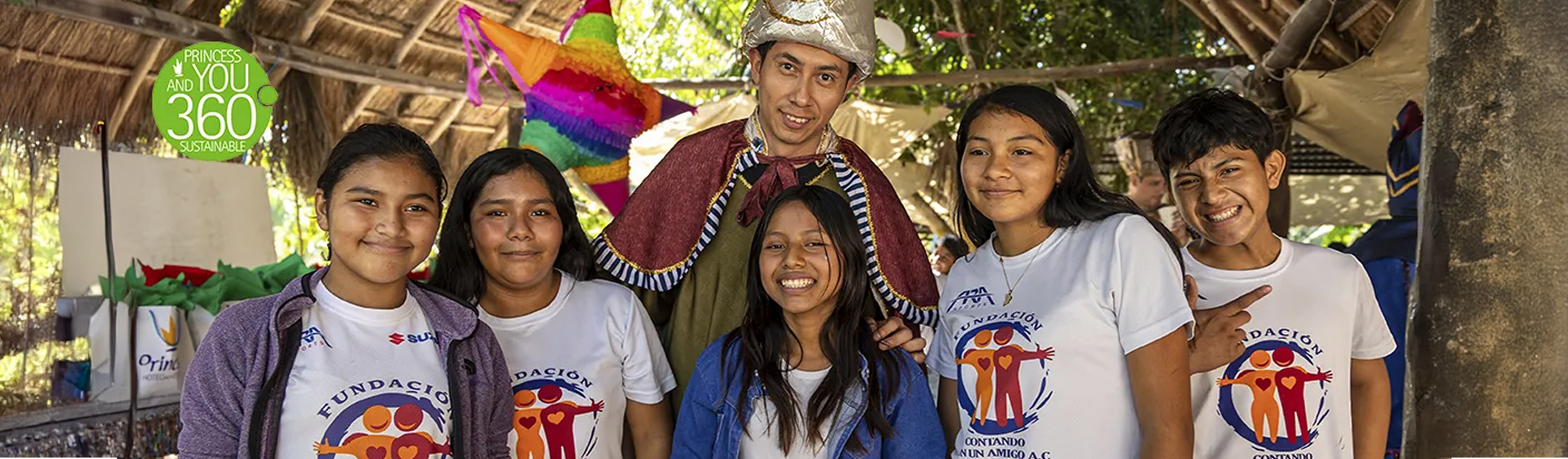 Children posing with a gift bearer