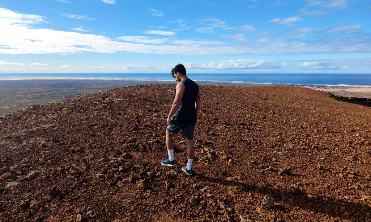 Man on the summit of a volcano in Fuerteventura