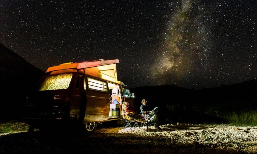 Couple in a campervan stargazing in La Palma Couple in a campervan stargazing in La Palma