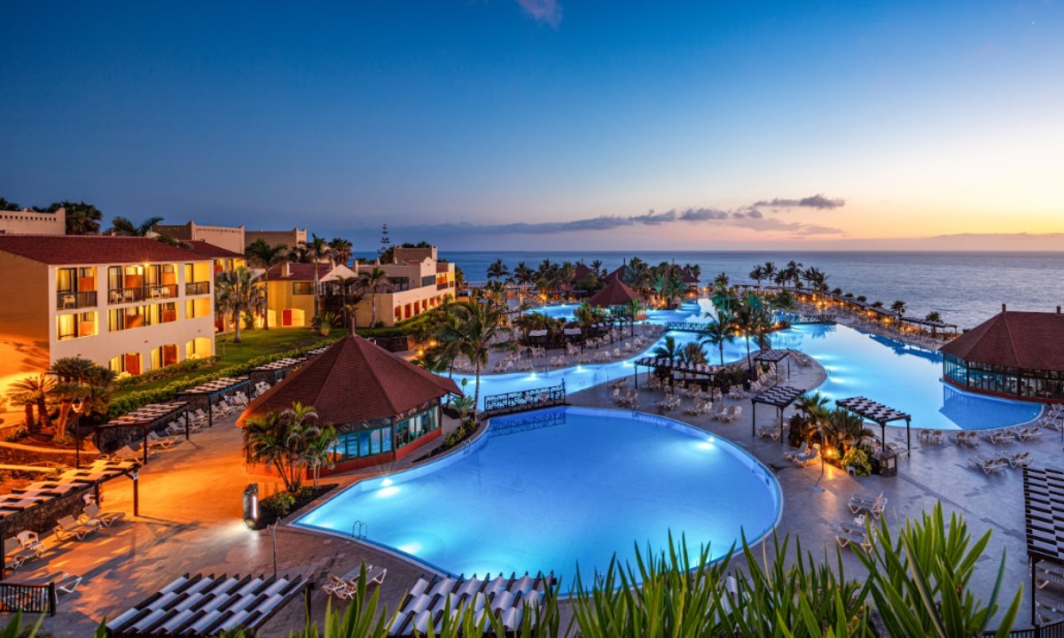 Night view of the illuminated pools at La Palma Princess hotel by the sea at sunset in La Palma.